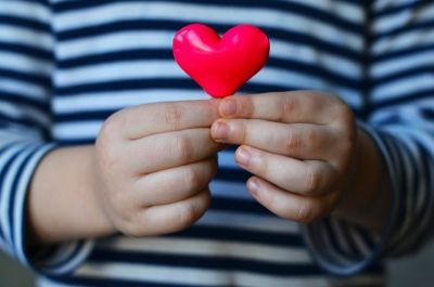 Child holding a heart